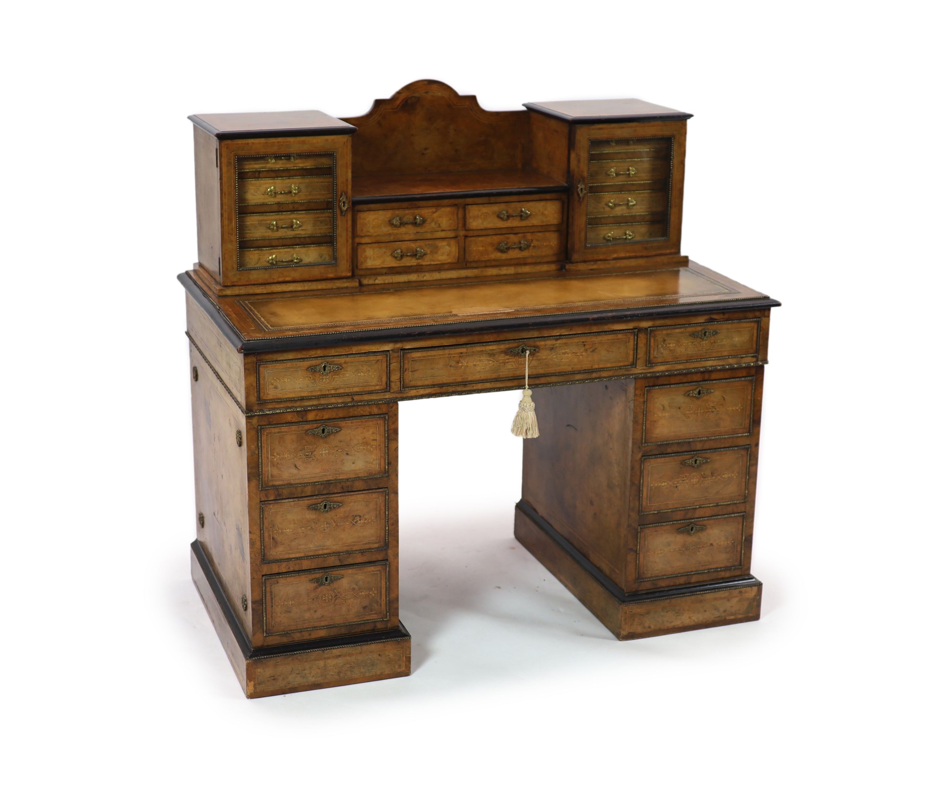 An Edwards & Roberts inlaid burr walnut pedestal desk, H 109cm. W 110cm. D 62cm.